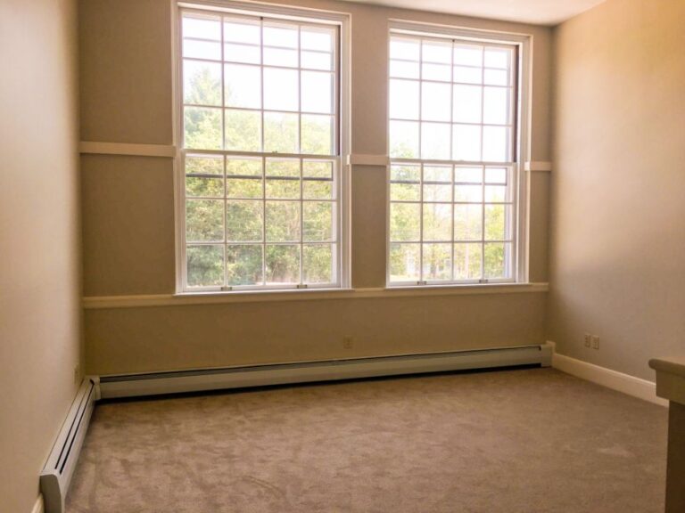 Empty room with two large windows