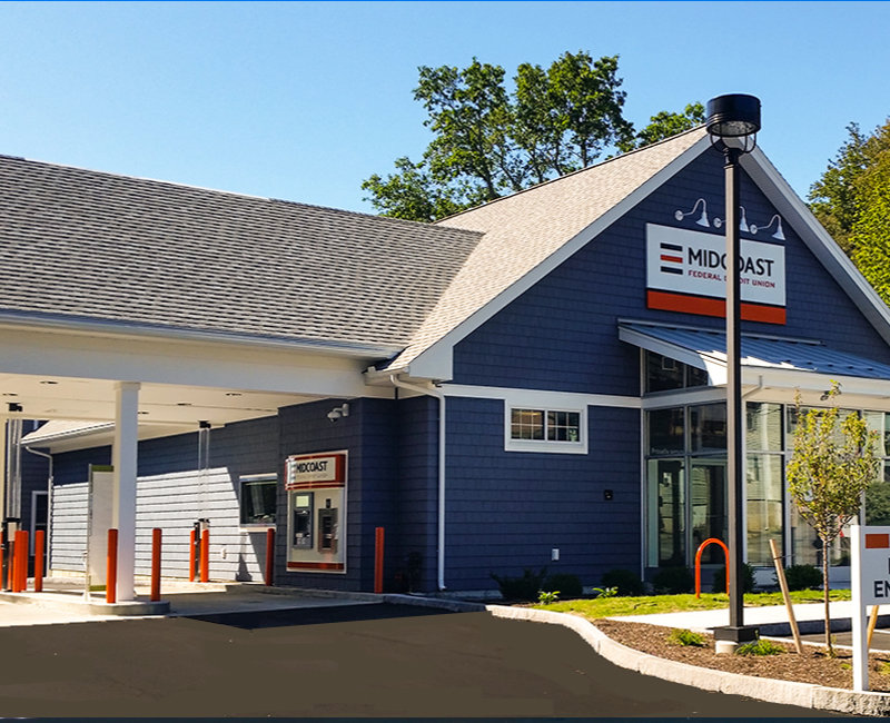 Navy building with logo and drive through for Midcoast Federal Credit Union - Bath