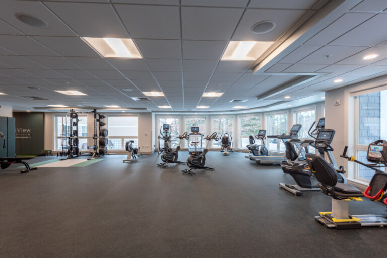 Gym area with cardio machines and weights