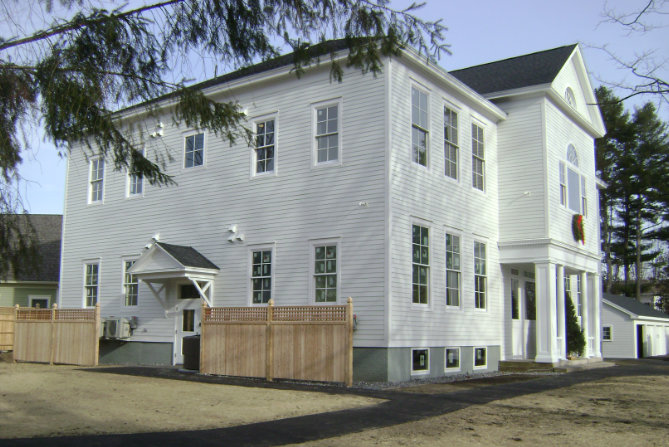 Large colonial white building