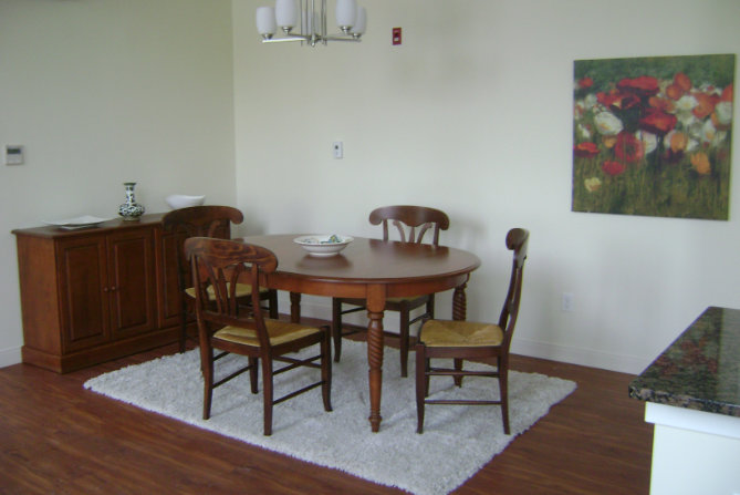 Interior of apartment with dining table and floral art